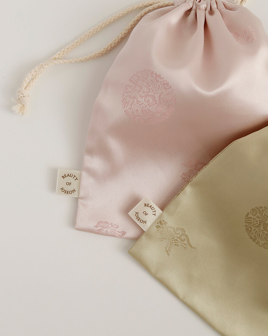 silk lucky pouch - elegant storage for skincare minis more